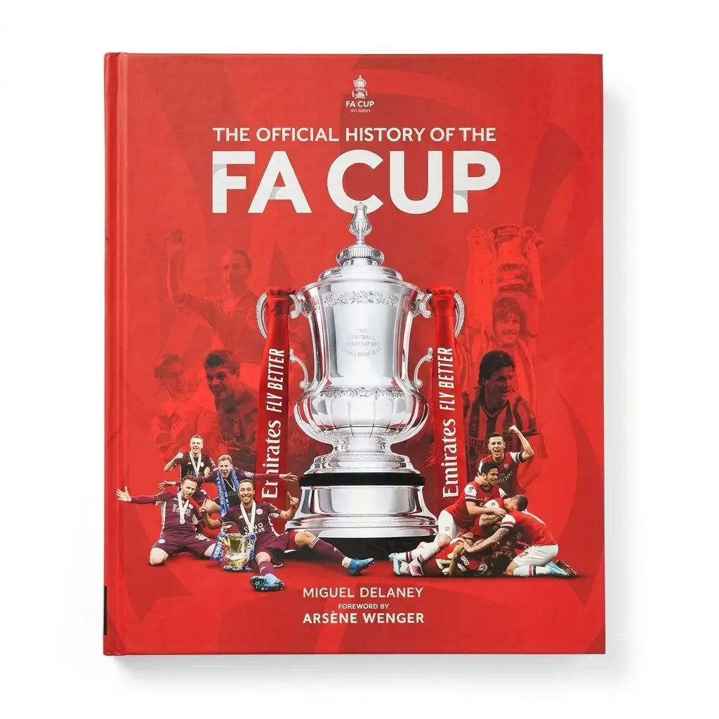 The Official History of the FA Cup book cover, featuring a bold red background with a large silver trophy in the center, player photos, and white title text.