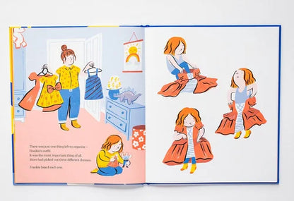 Illustrated book open to a page with characters in a room, one character sitting on the floor.