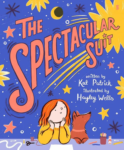 Book cover of 'The Spectacular Suit' with a girl and dog sitting on the floor surrounded by art supplies.