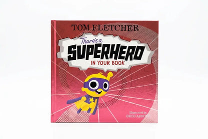 Book cover of 'There's a Superhero in Your Book' by Tom Fletcher with a superhero illustration on a red background.