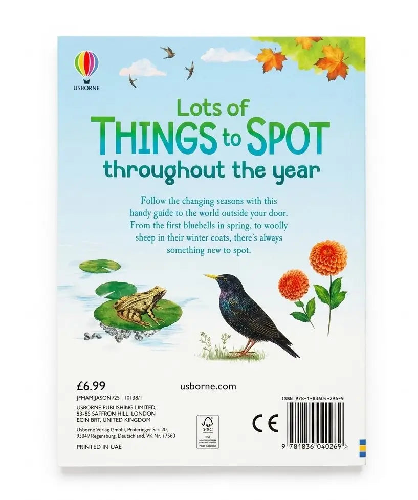 Front cover of a children's nature activity book titled 'Lots of THINGS to SPOT throughout the year' by Usborne. The cover features a light blue sky background with green title text, illustrations of a frog in a pond, a bluebird, orange flowers, and autumn leaves.