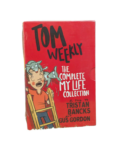 A vintage-style red book cover for 'Tom Weekly: The Complete My Life Collection' featuring cartoon artwork of a boy in an orange shirt and blue pants sitting in a chair with a gray creature on his head, with text crediting Tristan Bancks and Gus Gordon.