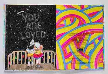 Book with two different covers, one with text 'You Are Loved' and a couple on a balcony, the other with colorful abstract design.
