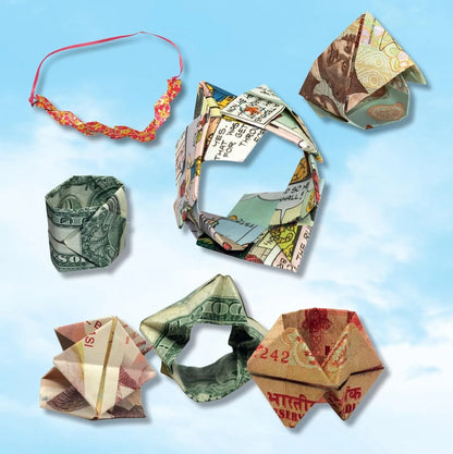 Origami creations made from various currencies on a blue background