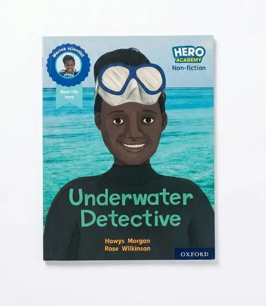 Children's non-fiction book titled 'Underwater Detective' by Howys Morgan and Rose Wilkinson, published by Oxford. The cover features an illustration of a young boy wearing a black wetsuit and blue-and-white diving goggles against a turquoise ocean background.