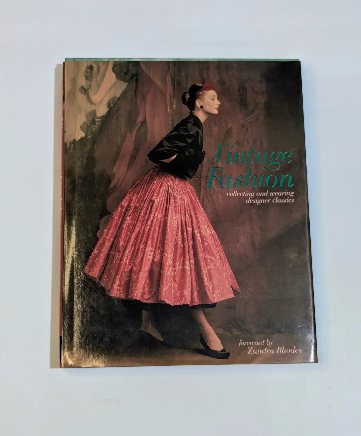 Book titled 'Vintage Fashion' with a cover featuring a woman in a pink skirt and black jacket.