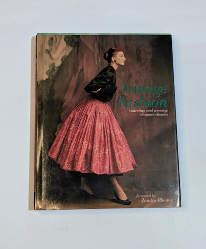 Book titled 'Vintage Fashion' with a cover featuring a woman in a pink skirt and black jacket.
