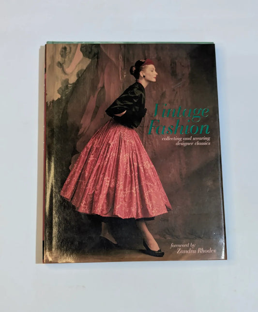 Book titled 'Vintage Fashion' with a cover featuring a woman in a pink skirt and black jacket.