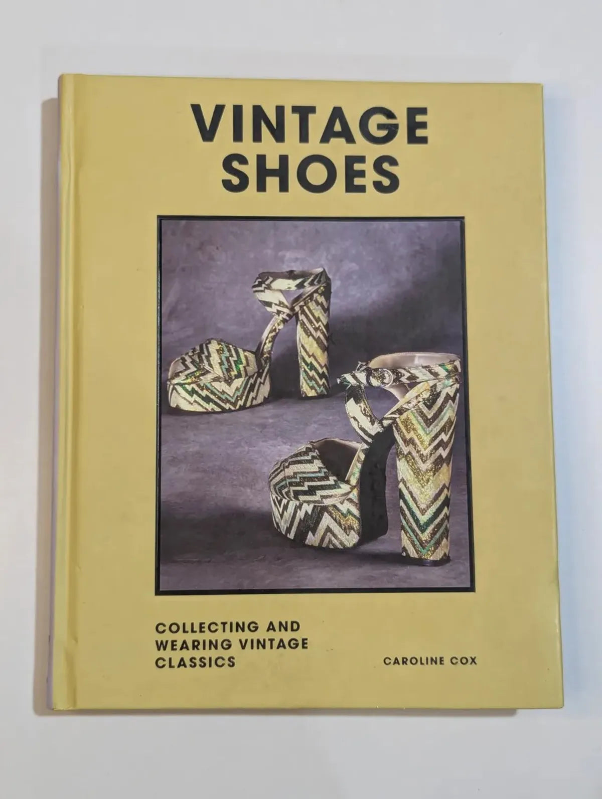 Book titled 'Vintage Shoes' by Caroline Cox with a cover photo of vintage high-heeled shoes.