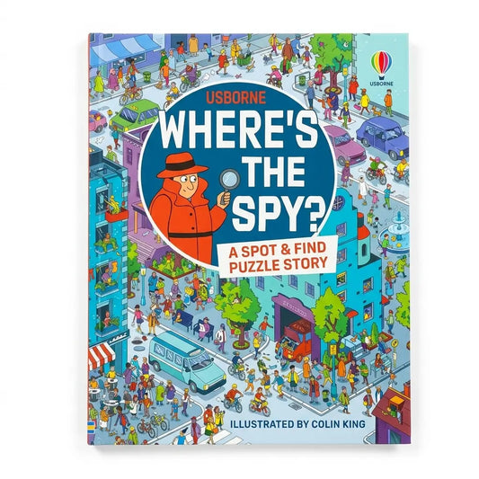 Usborne 'Where's the Spy?' children's puzzle book cover, featuring a colorful isometric illustration of a busy city street with a large blue circular badge in the center containing the title and an illustration of a spy holding a magnifying glass.