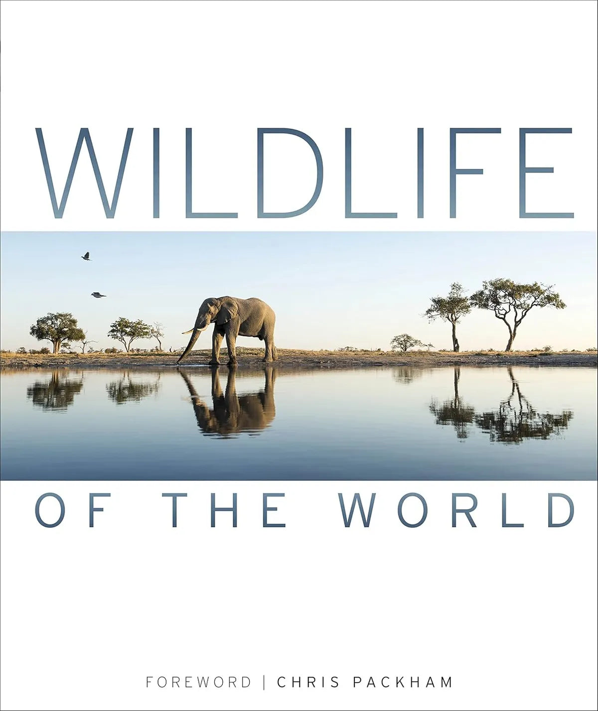 Book cover of 'Wildlife of the World' with an elephant at a watering hole.