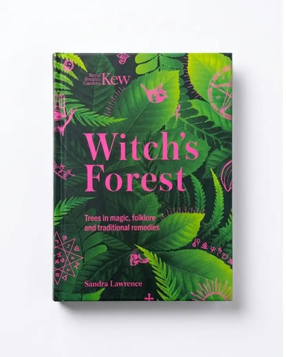 The book 'Witch's Forest' by Sandra Lawrence, published by Kew, features a dark green cover decorated with bright green tropical leaves and pink mystical symbols and typography.