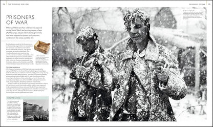 Two statues covered in snow in a snowy landscape with text on the left side.