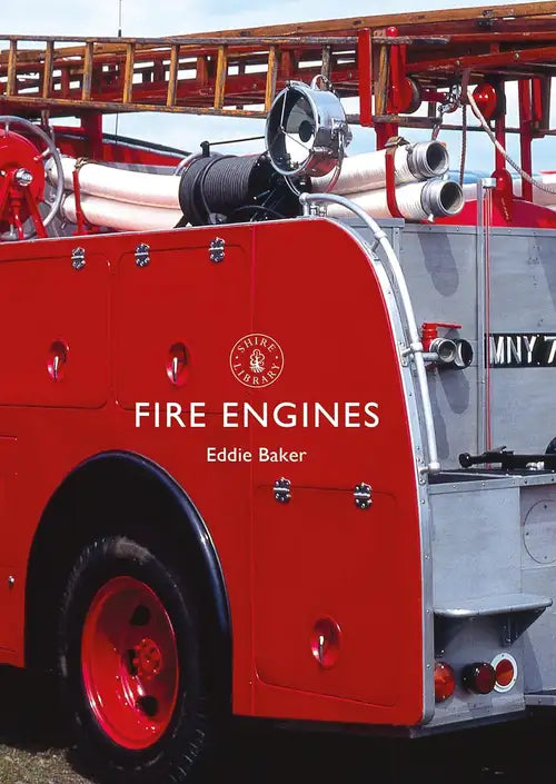 Red fire engine with 'Eddie Baker' branding on a clear day.